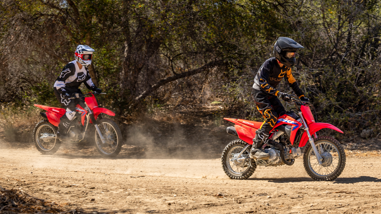 Two riders on Honda CRF Trail dirt bikes