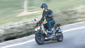 A rider on a Ruckus in an urban setting 